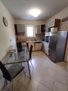 Kuchyň nebo kuchyňský kout v ubytování Apartma Laura