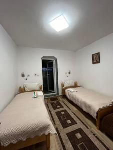 Un ou plusieurs lits dans un hébergement de l'établissement Guest House Rosenovi