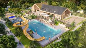 an overhead view of a swimming pool at a resort at Chalet type F in Voorthuizen