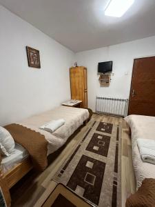 Un ou plusieurs lits dans un hébergement de l'établissement Guest House Rosenovi