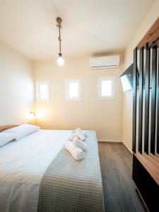 Łóżko lub łóżka w pokoju w obiekcie Casa la Scala