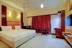 Säng eller sängar i ett rum på Palette - Chennai Deluxe Koyambedu