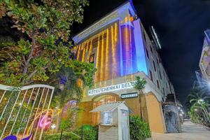 a building with lights on the side of it at Palette - Chennai Deluxe Koyambedu in Chennai