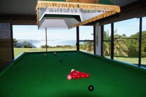 a pool table in a house with a view at Tsitsikamma on Sea Poolside Cabanas - they are not tents in Witelsbos