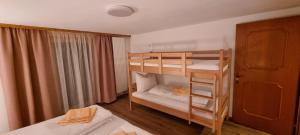 a bedroom with two bunk beds and a window at Ferienwohnung Marlin in Sankt Gallenkirch