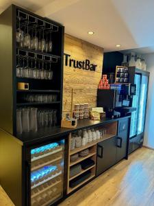 a coffee shop with a truck bar sign on the wall at NaturBoutique Hotel RAUSZEIT in Willingen