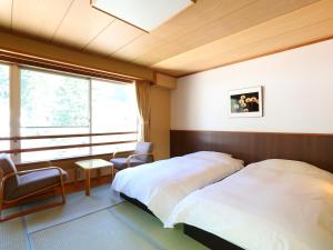 Postel nebo postele na pokoji v ubytování Ryokan Sakaya + 69 fotografií