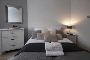 Posteľ alebo postele v izbe v ubytovaní Apartamenty City Center - Zdrojowe