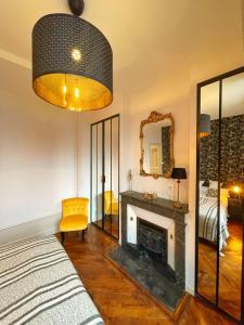 Posteľ alebo postele v izbe v ubytovaní Center Macon charmant appartement avec vue sur la Saone