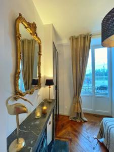 Posteľ alebo postele v izbe v ubytovaní Center Macon charmant appartement avec vue sur la Saone