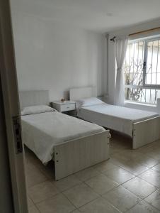 Ένα ή περισσότερα κρεβάτια σε δωμάτιο στο Departamento Céntrico