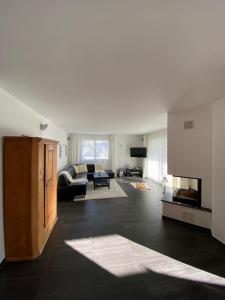 a living room with a couch and a fireplace at WEF Appartement in Davos