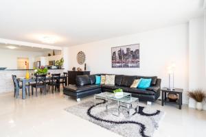 a living room with a couch and a table at Golden Bay 805 in Miami Beach