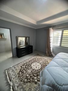 Säng eller sängar i ett rum på Lemajy Apartments