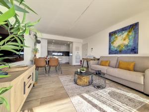 a living room with a couch and a table at Los Alcazares Velapi - 0810 in San Javier