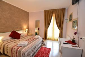 Voodi või voodid majutusasutuse Hotel Cima d'Oro toas