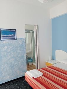 A bed or beds in a room at Albergo Belvedere