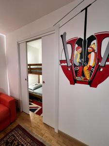 a room with a painting of a helicopter on the wall at White House in Sauze dʼOulx