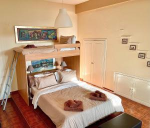 a bedroom with two bunk beds with hats on the bed at Modus Operandi in Kavála