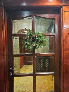 a door with a christmas wreath on it at Vila Geppetto in Belgrade