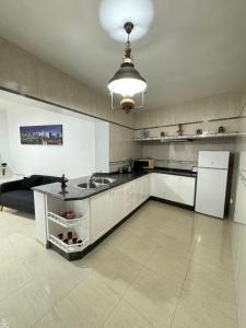Kuchyňa alebo kuchynka v ubytovaní Apartamento O Vento