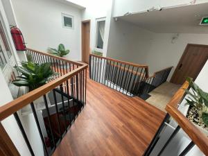 a staircase in a house with potted plants at Feliz Dalat Homestay in Da Lat