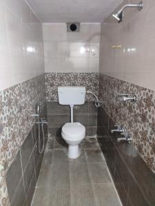 a bathroom with a toilet and a shower at Blue Diamond in Chennai