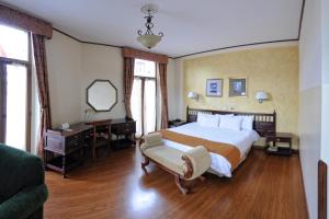Postel nebo postele na pokoji v ubytování Hotel Real Audiencia