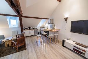 Kuchyňa alebo kuchynka v ubytovaní Résidence Leclerc - Appartements d'hôtes - Secteur thermal