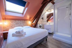 Posteľ alebo postele v izbe v ubytovaní Résidence Leclerc - Appartements d'hôtes - Secteur thermal