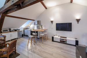 Kuchyňa alebo kuchynka v ubytovaní Résidence Leclerc - Appartements d'hôtes - Secteur thermal