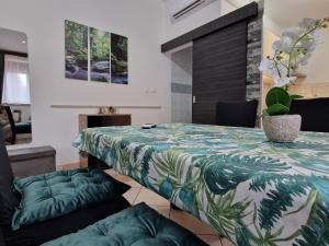 a room with a large bed with a table and chairs at Paradise in Pula