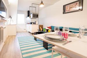 Kuchyňa alebo kuchynka v ubytovaní Résidence Leclerc - Appartements d'hôtes - Secteur thermal