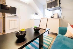 Kuchyňa alebo kuchynka v ubytovaní Résidence Leclerc - Appartements d'hôtes - Secteur thermal