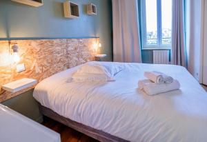 Posteľ alebo postele v izbe v ubytovaní Résidence Leclerc - Appartements d'hôtes - Secteur thermal