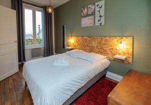 Posteľ alebo postele v izbe v ubytovaní Résidence Leclerc - Appartements d'hôtes - Secteur thermal