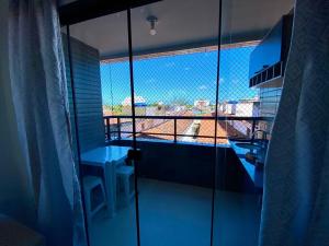 a bathroom with a view of a balcony at Apartamento Completo Praia do Poço - Cabedelo - PB in Cabedelo