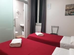 Postel nebo postele na pokoji v ubytování Nautilus Hotel