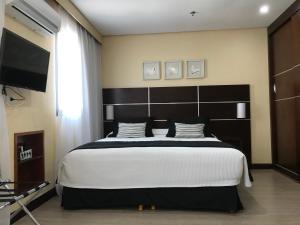 Кровать или кровати в номере Delicioso flat em área nobre +20 фотографий