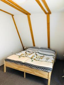 a bed in the corner of a room at Vikendica Topa’s in Vlasic