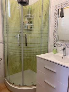 a bathroom with a glass shower and a sink at Apartamento Calypso in Cabo de Palos