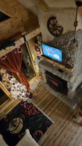 an overhead view of a living room with a flat screen tv at Chalet Wood Magic in Kolašin