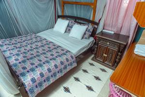 Un pat sau paturi într-o cameră la Donna Forte Residence