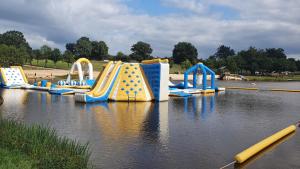 a water park with a water slide in the water at Domaine De La Tuillerie in Chaillac