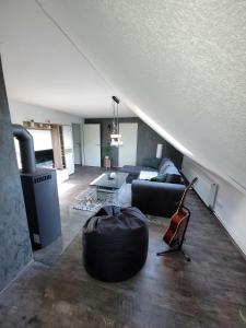 a living room with a couch and a table at Ferienwohnung 2 - a72142 in Wangerland
