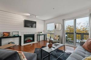 a living room with a couch and a fireplace at Downtown Nashville Riverfront unit 790 in Nashville