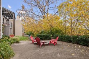 a group of red chairs sitting on a patio at Downtown Nashville Riverfront unit 790 in Nashville