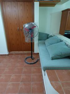 a room with a fan next to a bed at sahl hashesh makadi- hurghada- in Hurghada