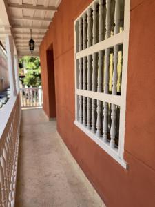 an empty hallway of a building with a balcony at Casa Noa Colonial Rooms By SOHO in Cartagena de Indias