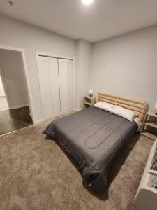 a bedroom with a large bed in a room at Astonishing 2BR Apt Mins to NYC in Jersey City